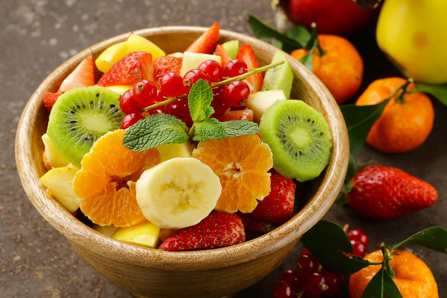 Fresh organic fruit salad (kiwi, strawberry, banana, currant, ap