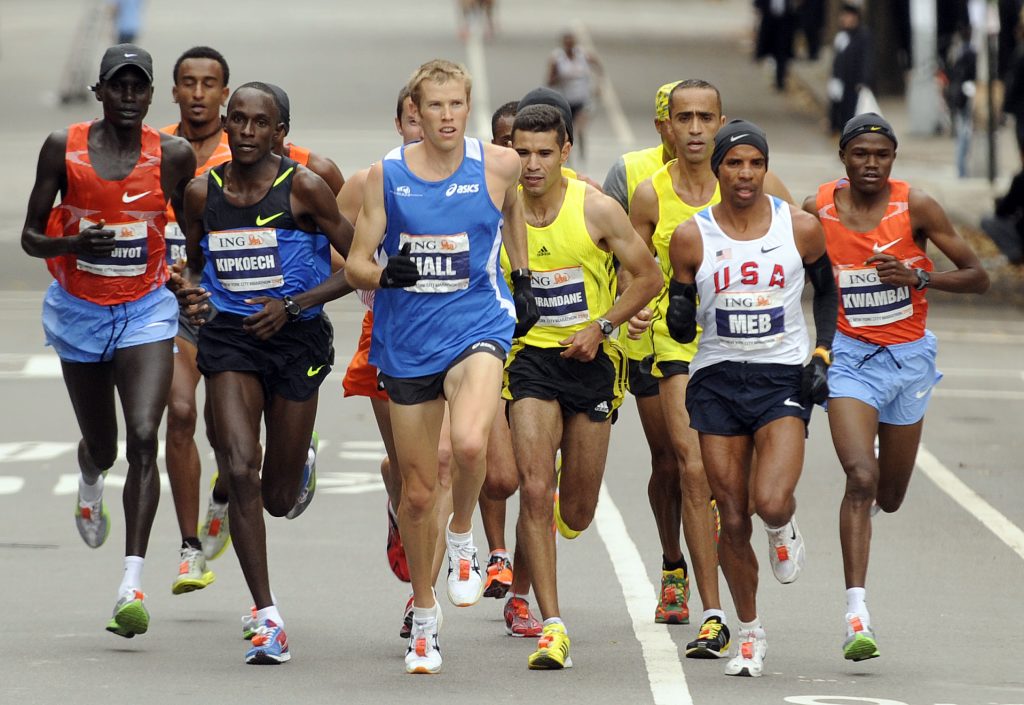 Americans Meb Keflezighi, second from right, and Ryan Hall, center, lead the New York City Marathon, Sunday, Nov. 1, 2009. Keflezighi won the race and Hall was fourth. Kenya’s Robert Cheruiyot, left, was second. (AP Photo/Henny Ray Abrams)