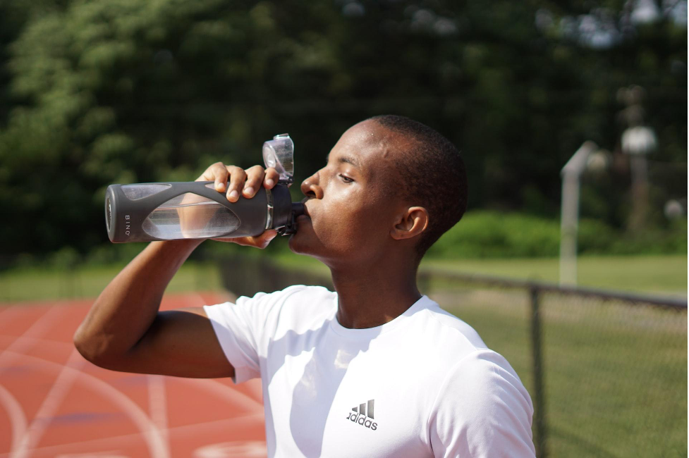 man drinking water healthy habit